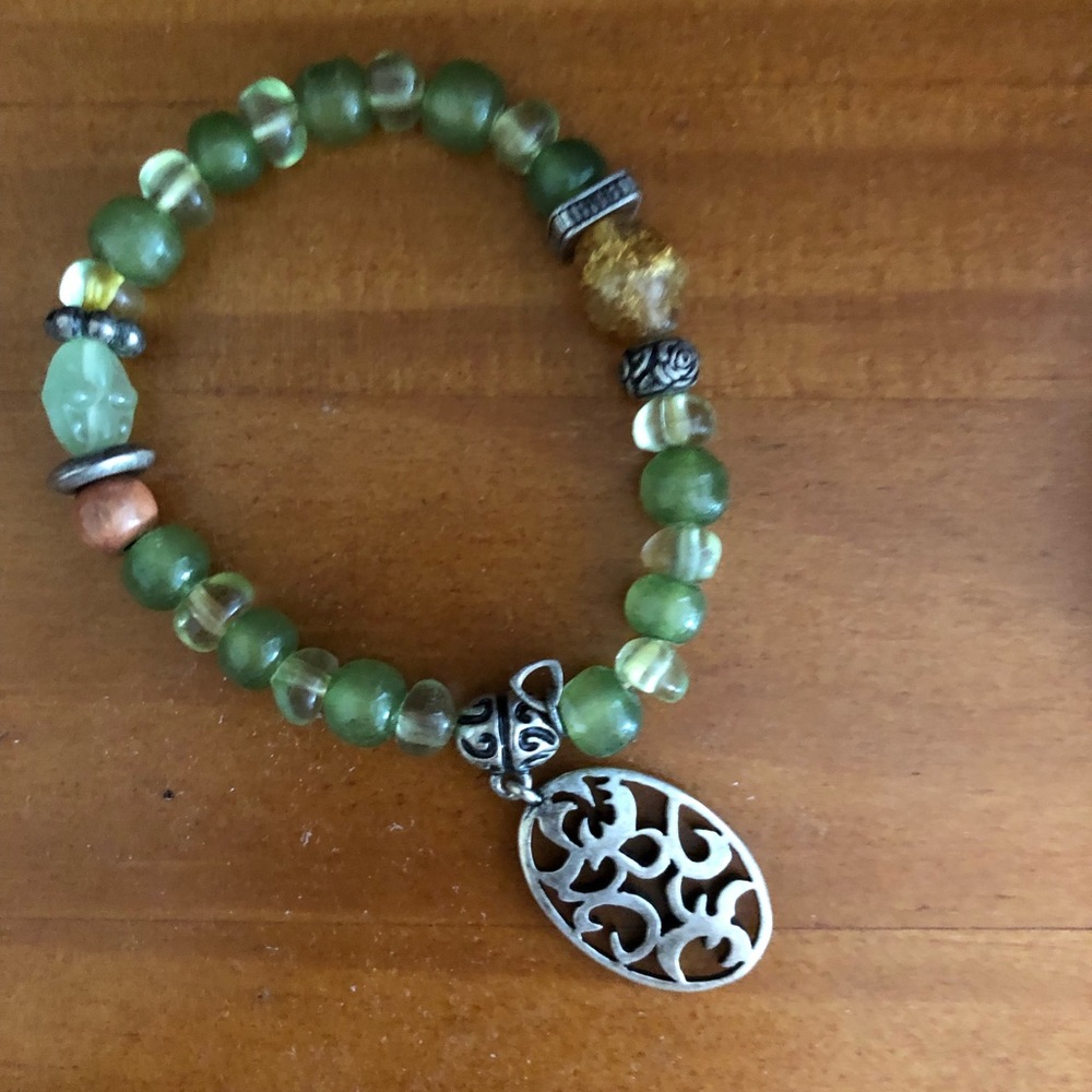 Lime green beaded bracelet with charm